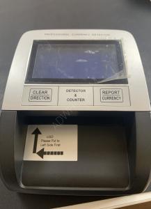 Counterfeit dollar detection machine  