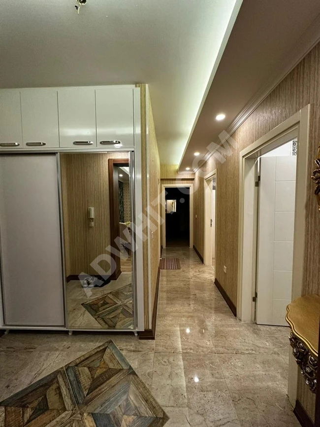 A new, first-class, new furnished apartment in Istanbul for sale, Esenyurt, Akevler district, within a complex of two rooms and a hall, an area of ​​110 m, a floor of 15, an independent kitchen, a view of the swimming pool