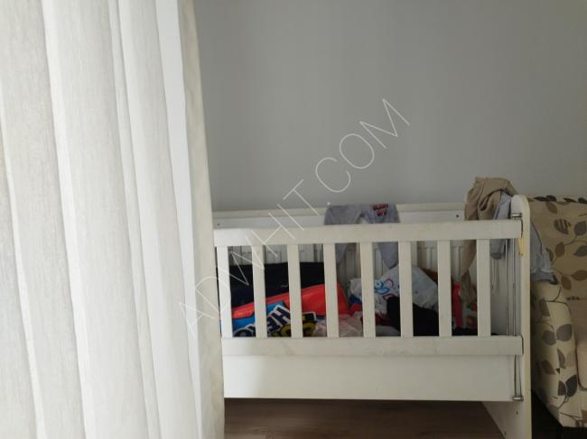 Used baby bed with rocking