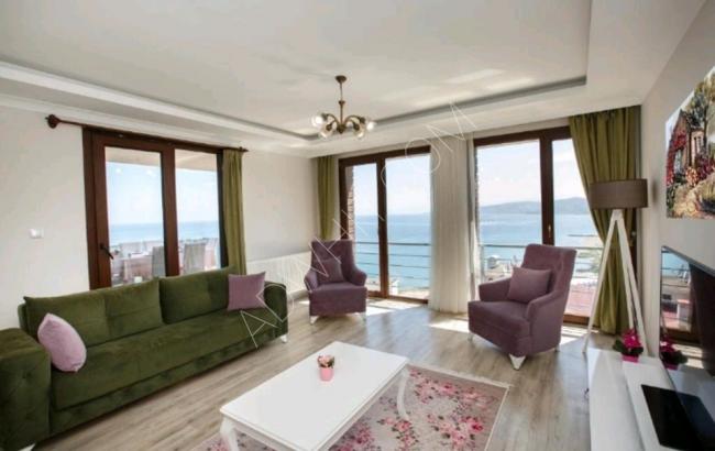 Furnished apartments in Trabzon, sea view, three rooms and a hall for daily rent. There are games for children
