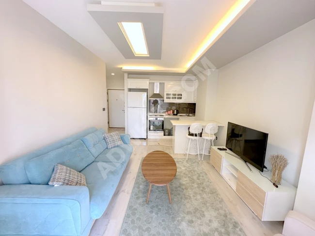 Cumhuriyet bölgesindeki bir konut sitesi içerisinde 1.5+1 eşyalı daire, deniz manzaralı