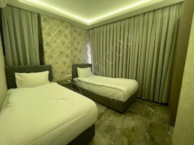 Hotel apartments in Bursa  close to the Marka Mall, three rooms, a hall, a kitchen, two bathrooms, and a balcony