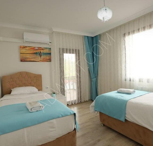 Trabzon Yomra'da üç odalı ve bir salonlu deniz manzaralı bir otel konseptinde daire