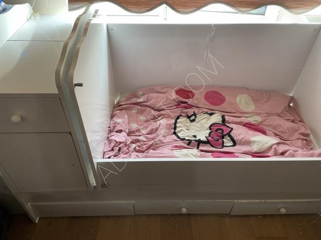 Children's bed with a wardrobe
