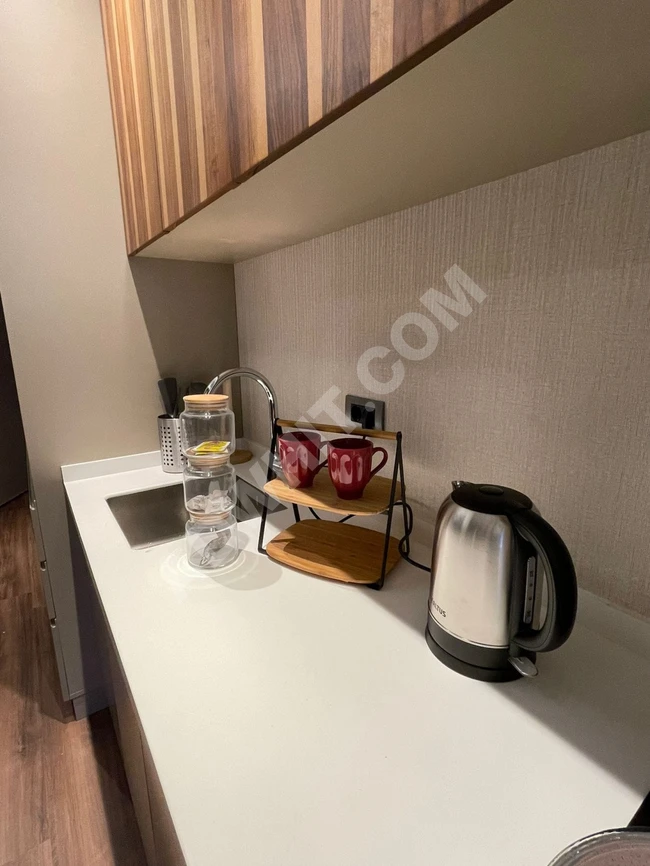 Hotel apartments for monthly tourist rent at 1450 dollars a month, including bills, a room and a hall near Mall of Istanbul and Medipol Hospital