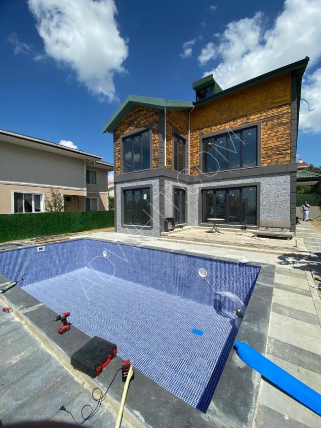 Villa for sale in Buyukcekmece, Istanbul, suitable for citizenship, with a swimming pool. Code: v-0191