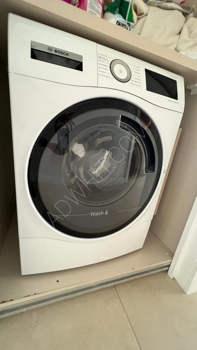 A used washing machine in like-new condition with a valid warranty