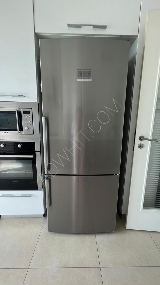 A used fridge in new condition with a valid warranty for a year and a half