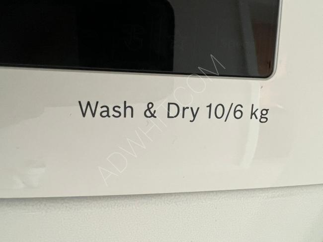 A used washing machine in like-new condition with a valid warranty