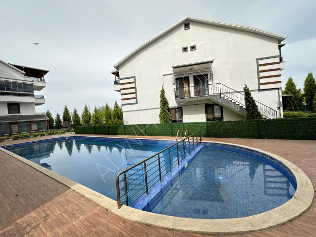 For sale, a spacious 4+1 duplex apartment in a complex with a swimming pool in Yenikoy, Bashekesir