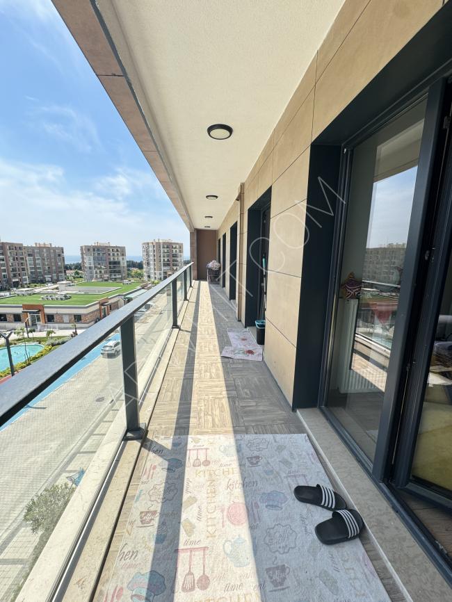 Apartment for urgent sale 3+1 in the Bizim Evler complex with a sea view