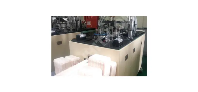 A machine for manufacturing paper food containers at a speed of 40 units per minute