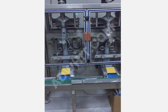 A vertical machine for filling and packaging powder products