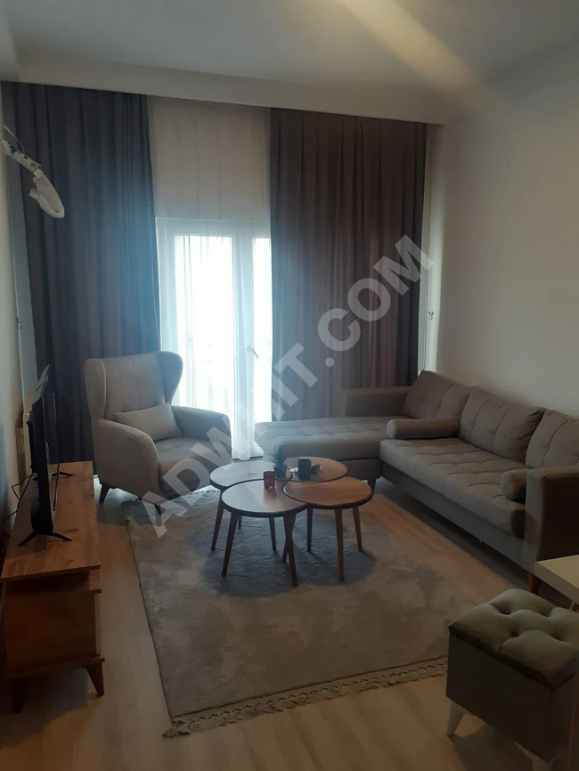 1+1 apartment for sale with furniture in Bahçeşehir