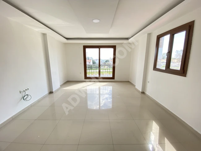 Spacious and bright 2+1 apart with sea view for sale in Doğanbey