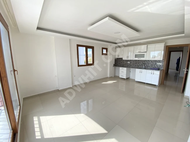 Spacious and bright 2+1 apart with sea view for sale in Doğanbey