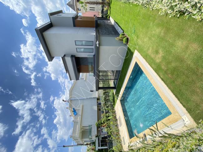 4+1 villa for sale in Gumuldur with a pool and underfloor heating