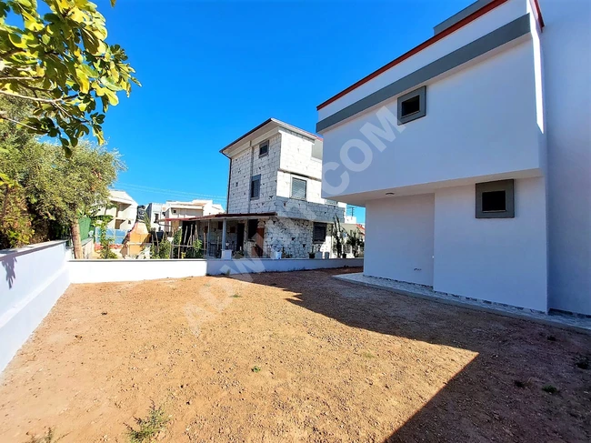 Independent 3+1 summer apartment with a garden for sale in Dogan Bey