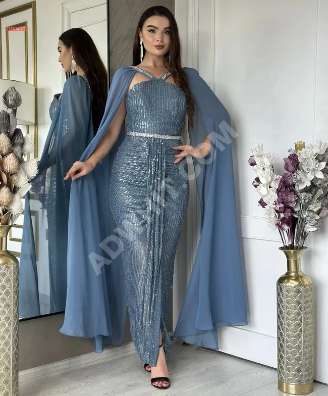 Evening dress with rhinestones and chiffon on the sleeve