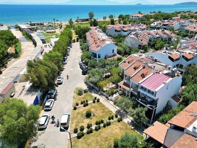 3+1 villa for sale in Doganbey within a residential complex by the sea