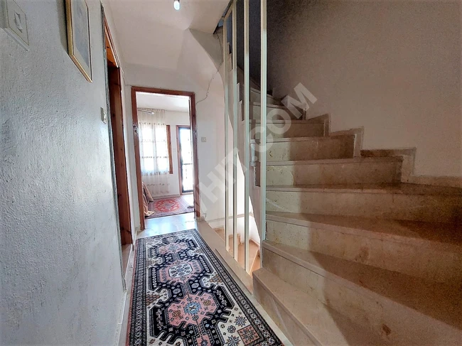 3+1 villa for sale in Doganbey within a residential complex by the sea