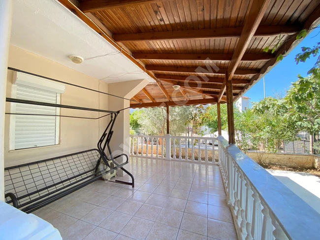 Independent villa for sale at a reasonable price in Doğan Bey, featuring a large garden, four rooms, and a living room