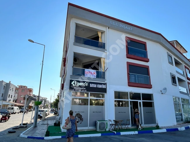 A new apartment for sale, covering an area of 85 square meters in the center of Orkmaz Seferihisar, featuring two rooms and a living room