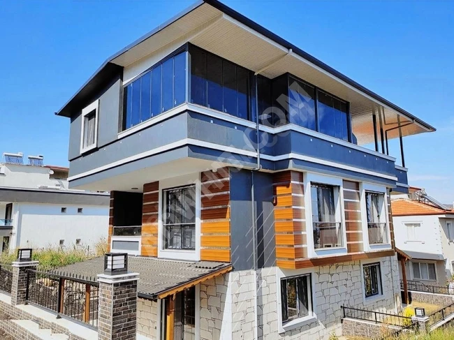 A standalone complete villa 3+1 with a sea view for sale in Doğan Bey